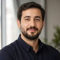 A professional Azerbaijani author portrait featuring a neutral background, age 28-45, smart casual attire, trustworthy appear